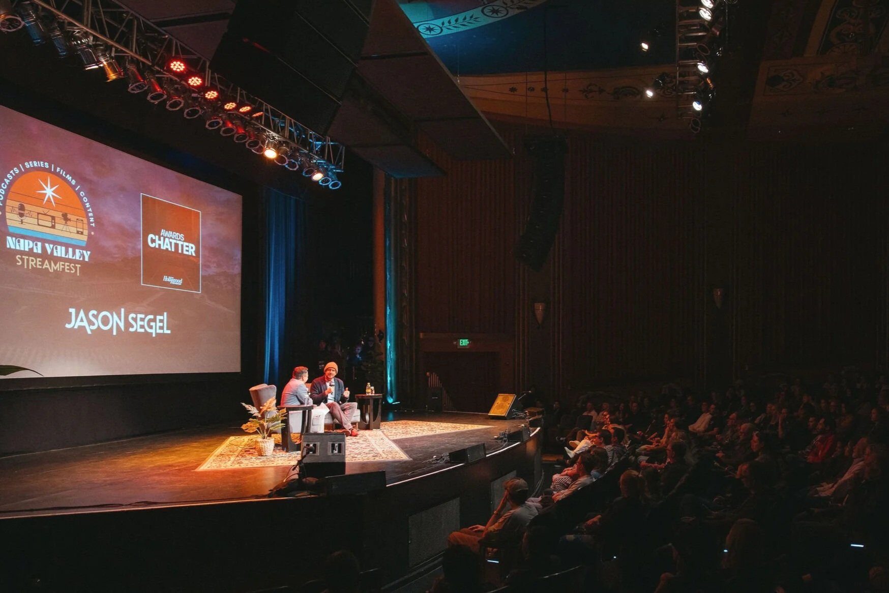 Awards event on stage at the Uptown Theatre with audience