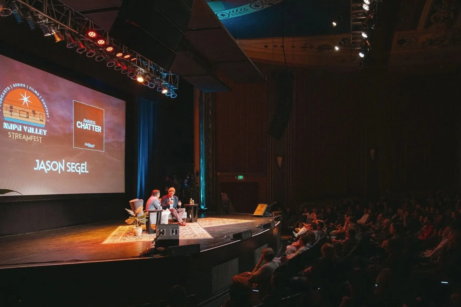 Awards event on stage at the Uptown Theatre with audience